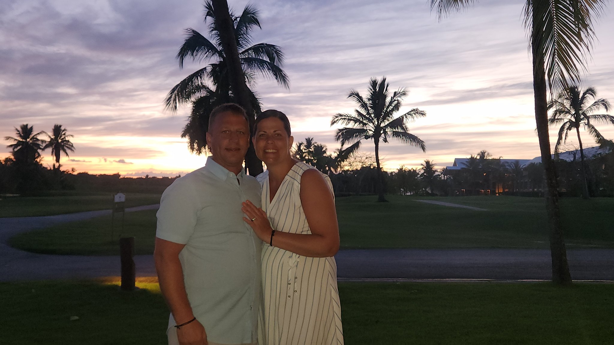 Couple at sunset with palm trees